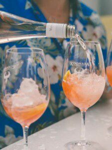 Image is of our Moscato being poured into an Aperol Spritz cocktail