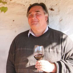Our People: Peter Douglas holding a glass of wine
