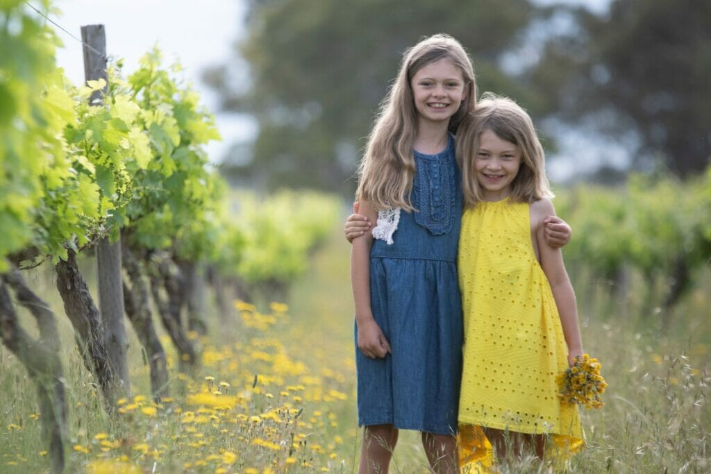 Lucy and Alice in the vineyard - who we named our Pinot Gris after.