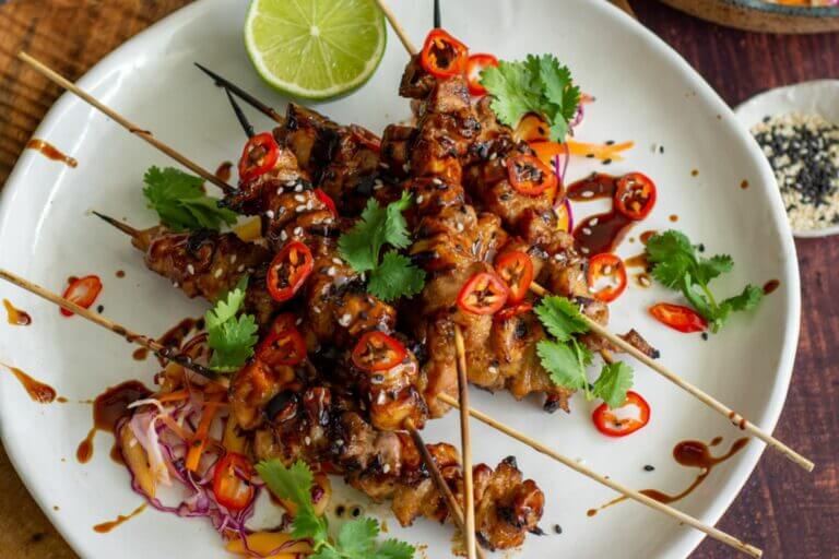 Close up of the Asian Pork Belly Skewers with mango slaw